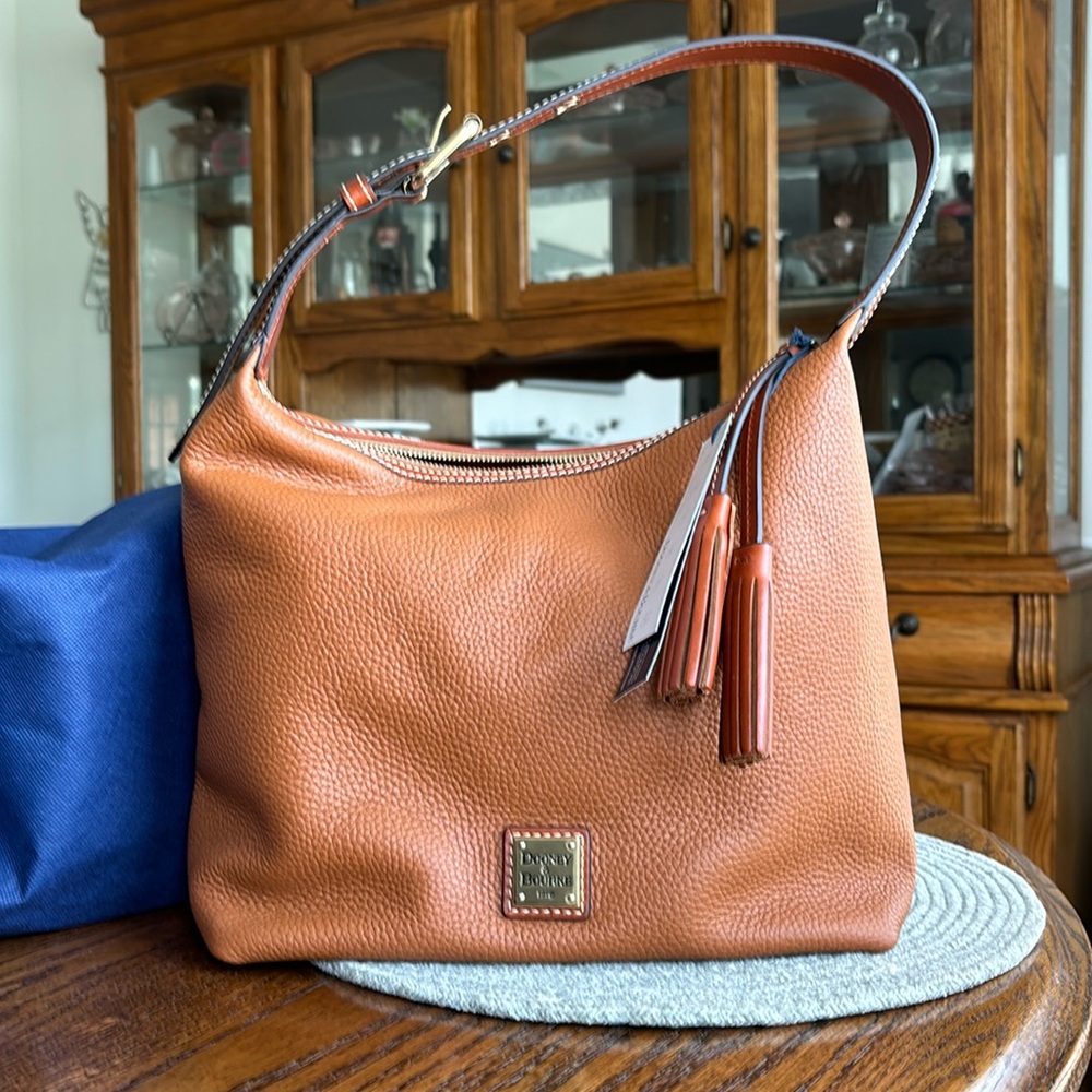 Brand new Dooney and Bourke Paige Sac in the color caramel.
